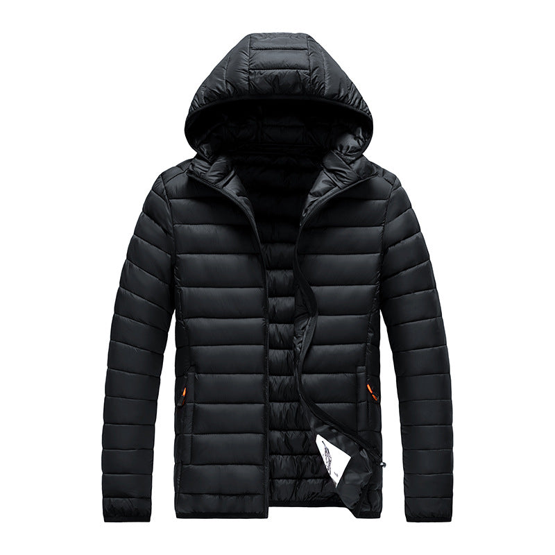 Men's black hooded slim-fit puffer jacket with quilted panels and orange zipper accents.