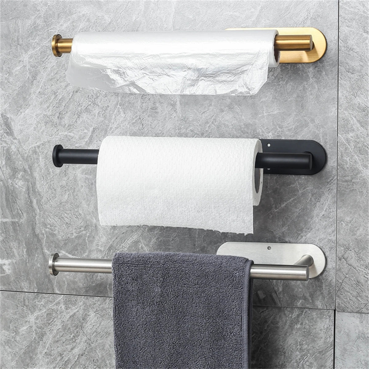 Paper towel holder set; three wall-mounted organizers in gold, black, and stainless finishes.