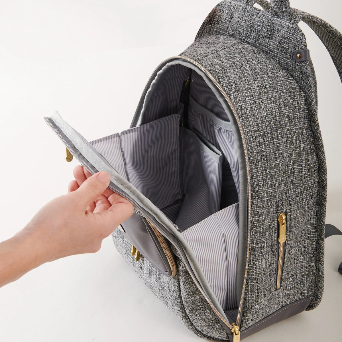 Sunveno diaper bag backpack in gray tweed fabric with multiple interior pockets and gold-tone zippers