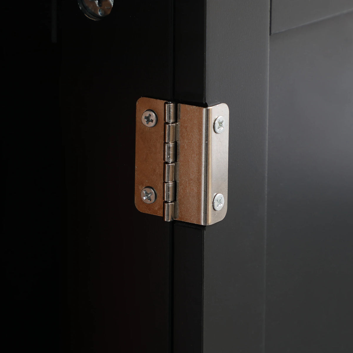 Homcom under-sink bathroom cabinet in black with a door hinge close-up.