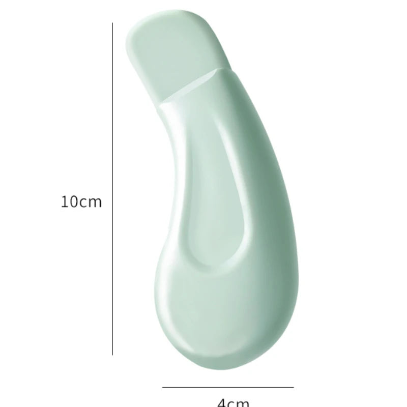 Silicone nose blackhead remover tool in mint green, 1pc by S And B Enterprise, about 10 cm long.
