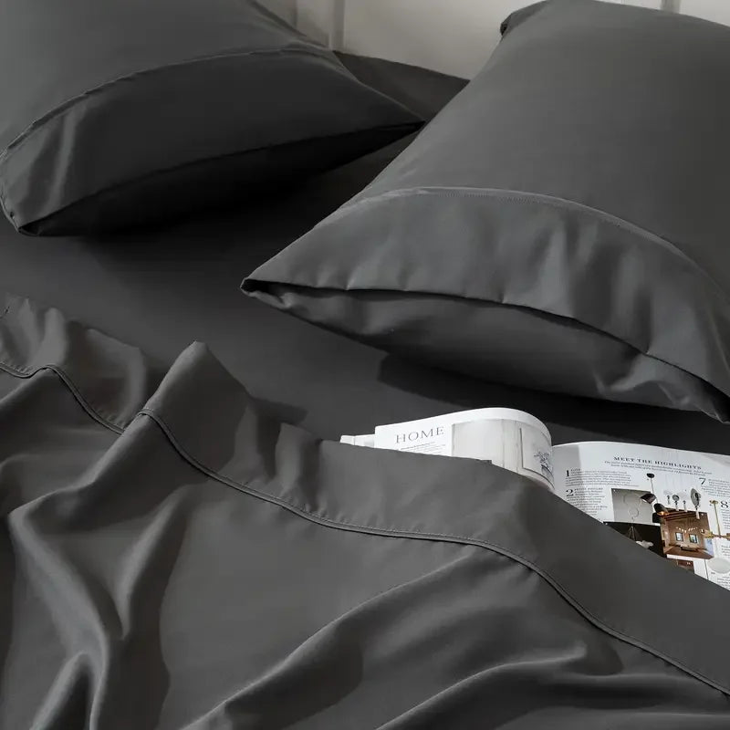 Gray bamboo cooling queen sheet set with pillowcases on bed