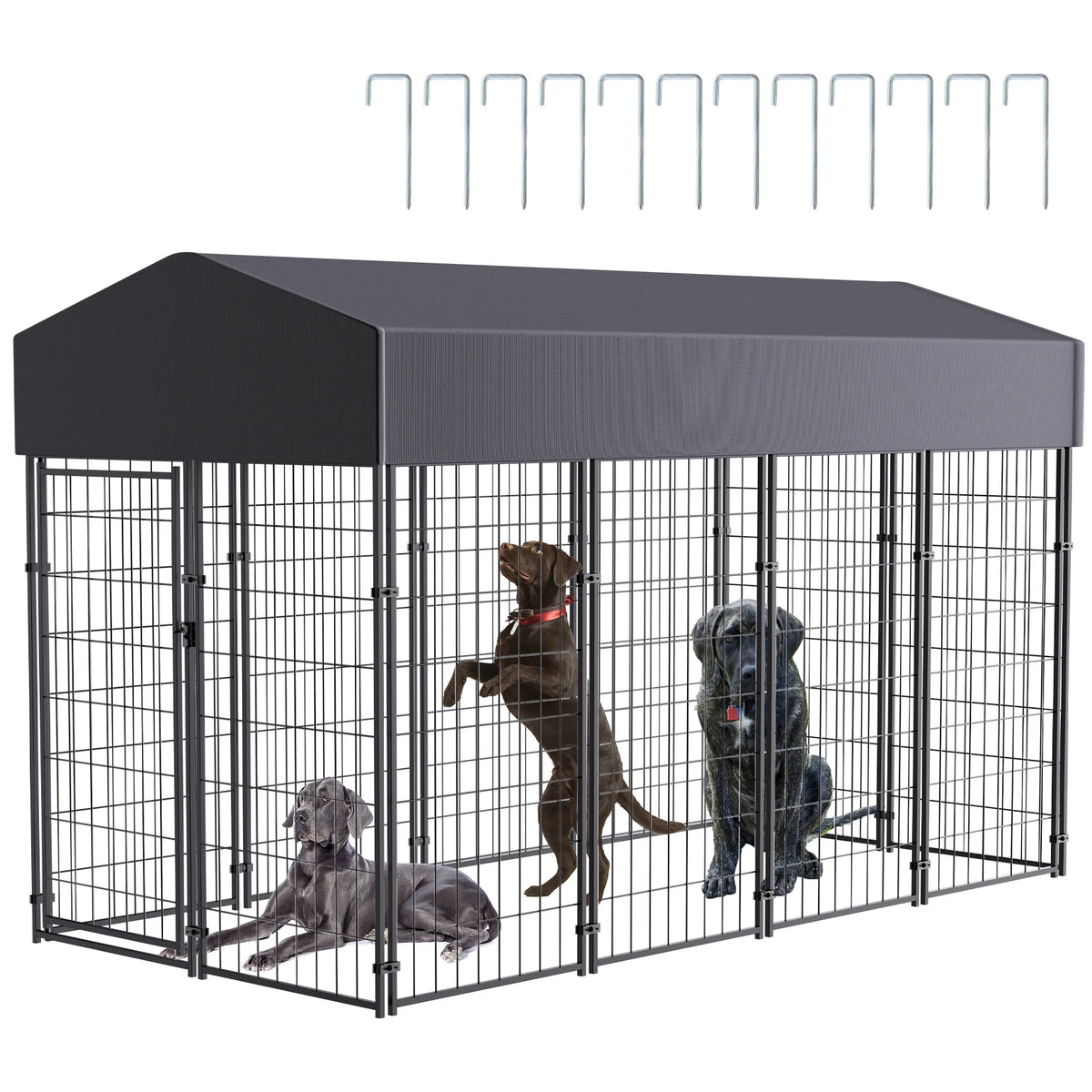 Large outdoor dog kennel with welded wire panels and dark canopy; includes ground stakes and several dogs inside.