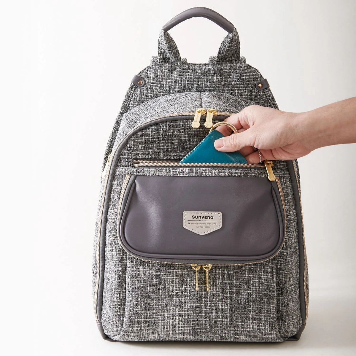 Sunveno diaper bag backpack in gray tweed with a gray front pocket and gold zippers