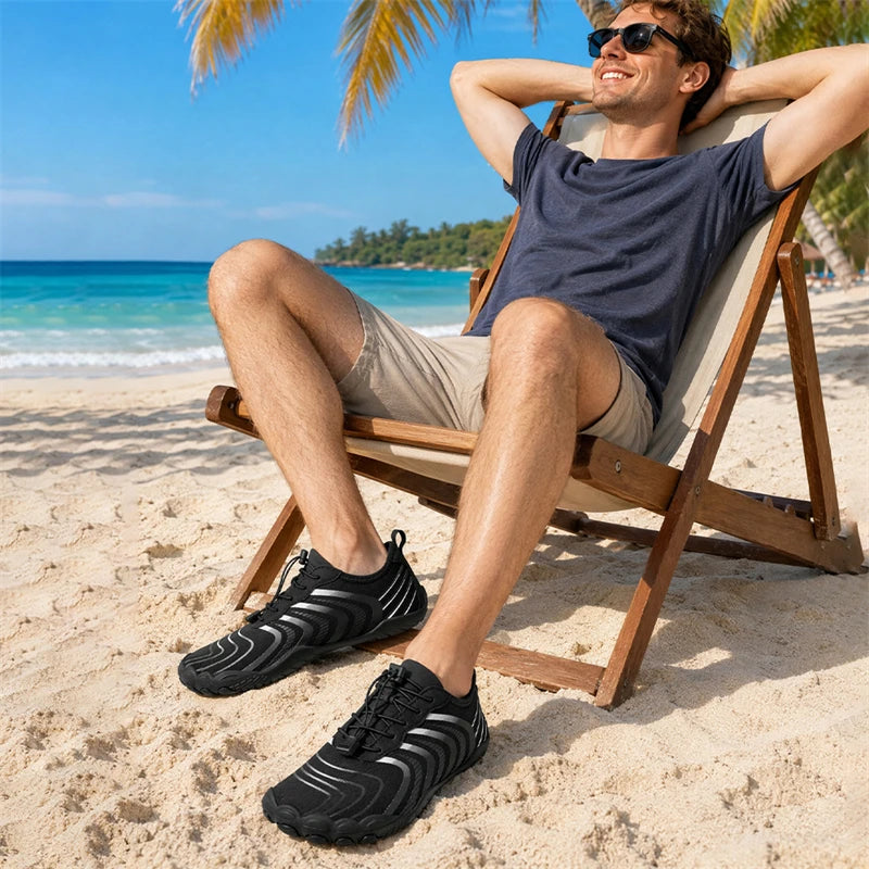 Men's water shoes by S And B Enterprise, black quick-dry aqua sneakers for beach and water activities.