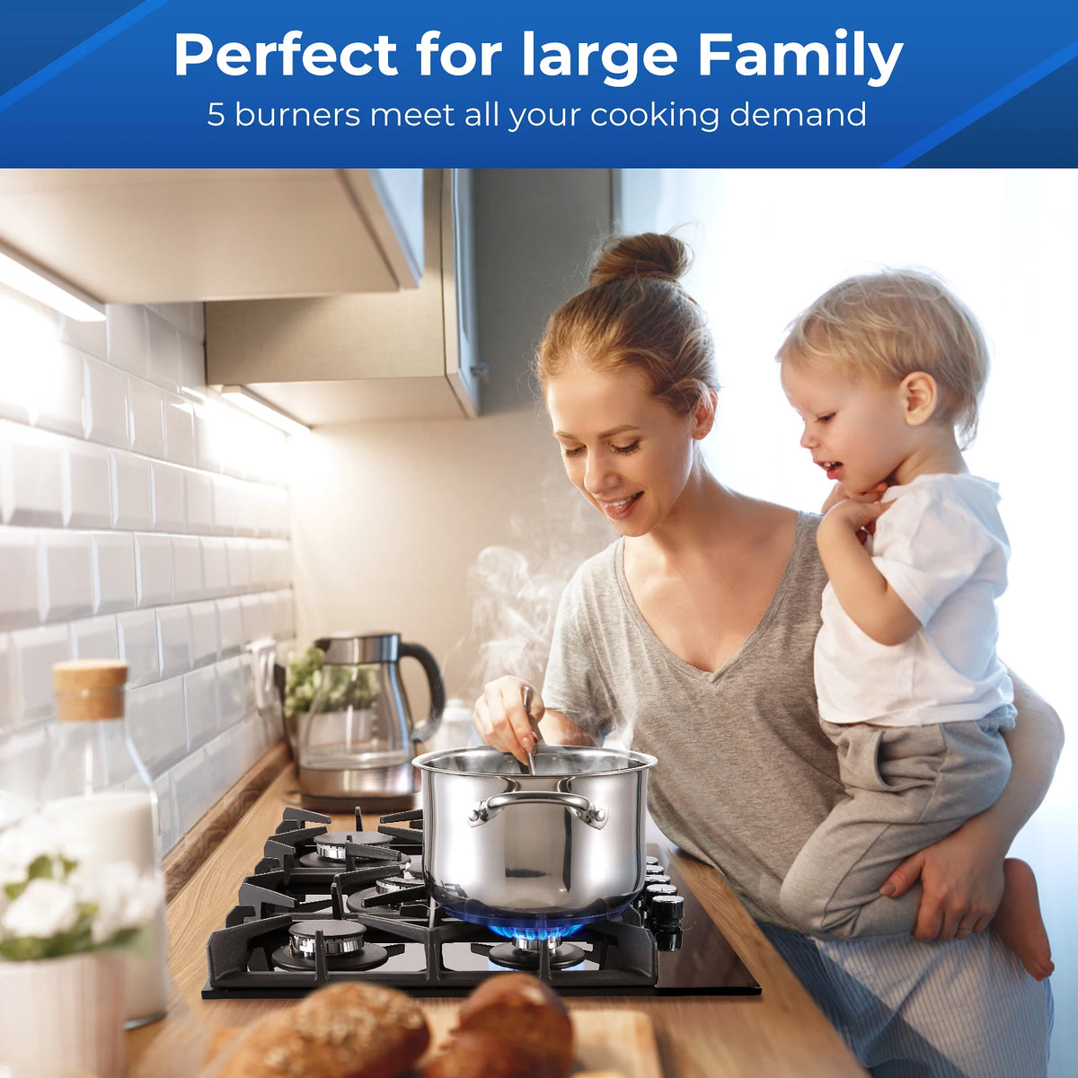 30-inch black glass gas cooktop with 5 burners on a wooden kitchen counter, pot steaming.
