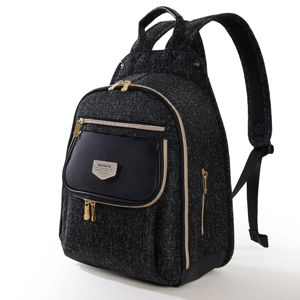 Sunveno diaper bag backpack in black speckled fabric with gold zippers and front logo pocket