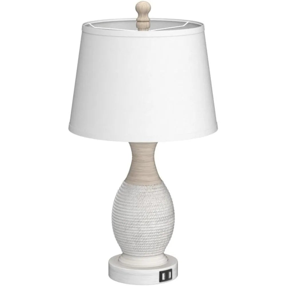 Table lamp with white fabric shade and textured ceramic base