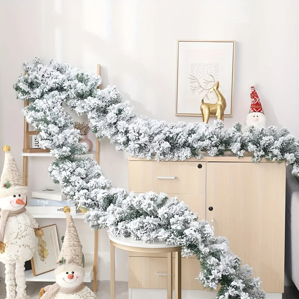 Snowy Christmas garland, 9ft snow-flocked artificial pine with frosted white look
