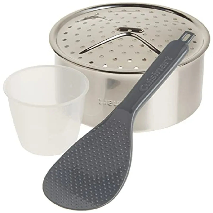 Rice cooker with silver stainless steel exterior, includes gray rice paddle and measuring cup.