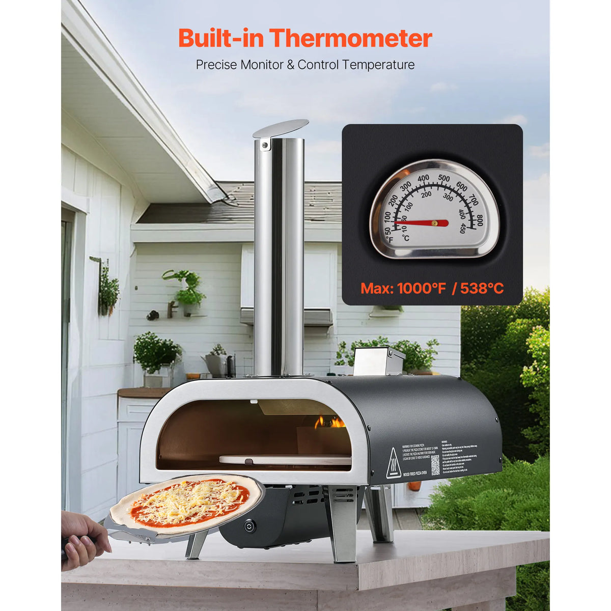 SucceBuy outdoor pizza oven, 12-inch wood-fired with built-in thermometer, by S And B Enterprise; pizza being inserted.