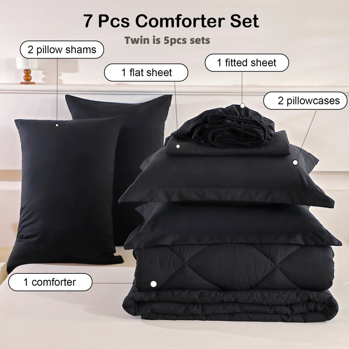 Black 7-piece bedding set with comforter, flat sheet, fitted sheet, two pillow shams and two pillowcases