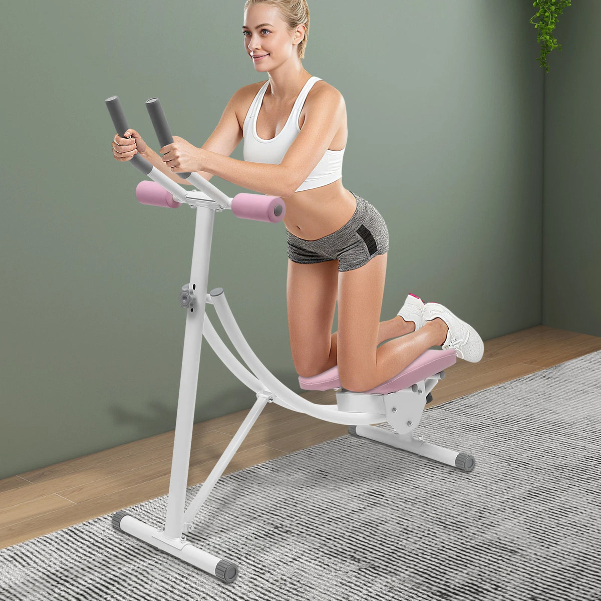 Abdominal trainer by S And B Enterprise; white foldable gym machine with pink padded rollers for home gym