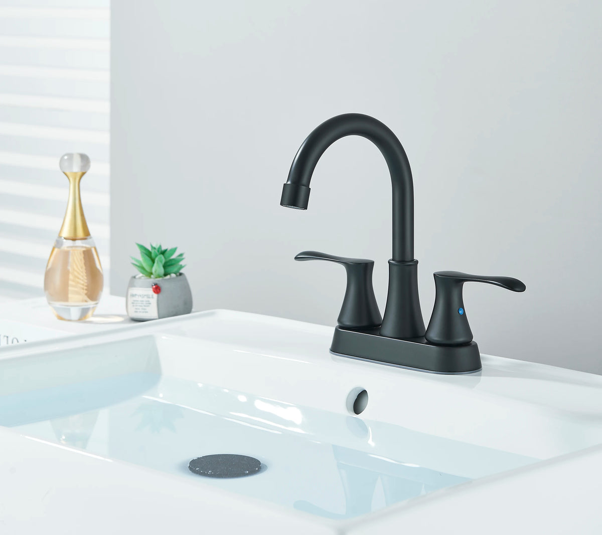 S And B Enterprise black bathroom faucet with dual handles, 4-inch centerset for 3-hole sink.