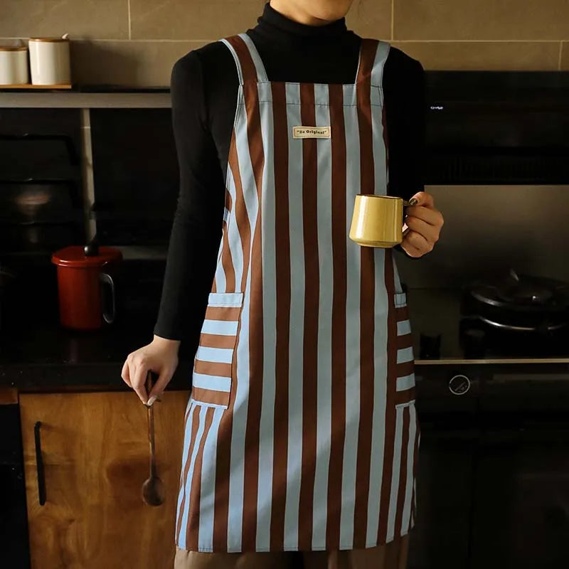 Waterproof women's cross-back striped apron with pockets, polyester-cotton, blue and brown vertical stripes.