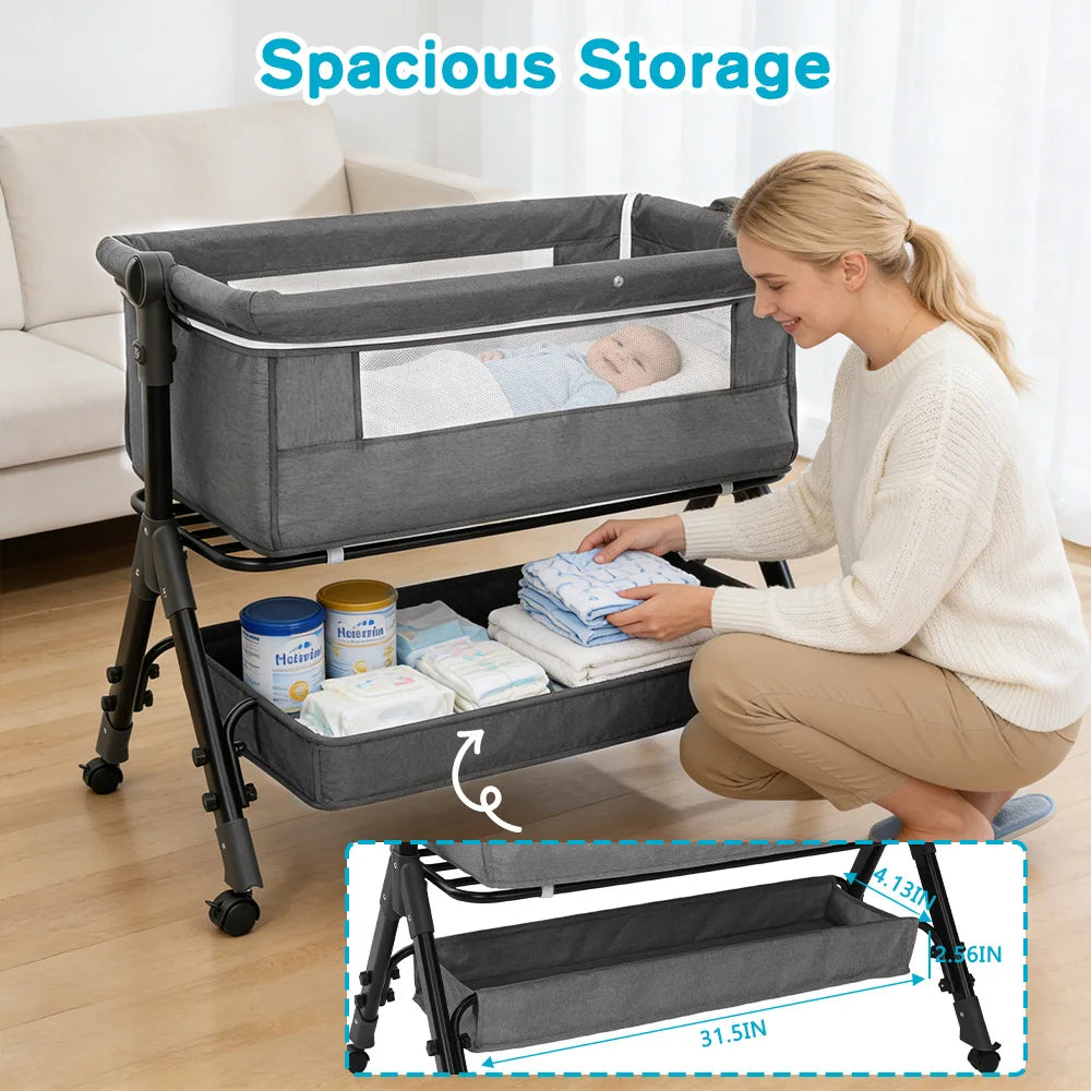 Gray portable foldable baby bassinet on a wheeled stand with under-bed storage for 0–18 months.