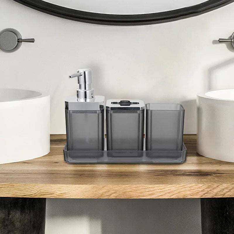 3-piece hotel bathroom accessories set by S And B Enterprise in gray electroplated plastic on a tray with soap dispenser