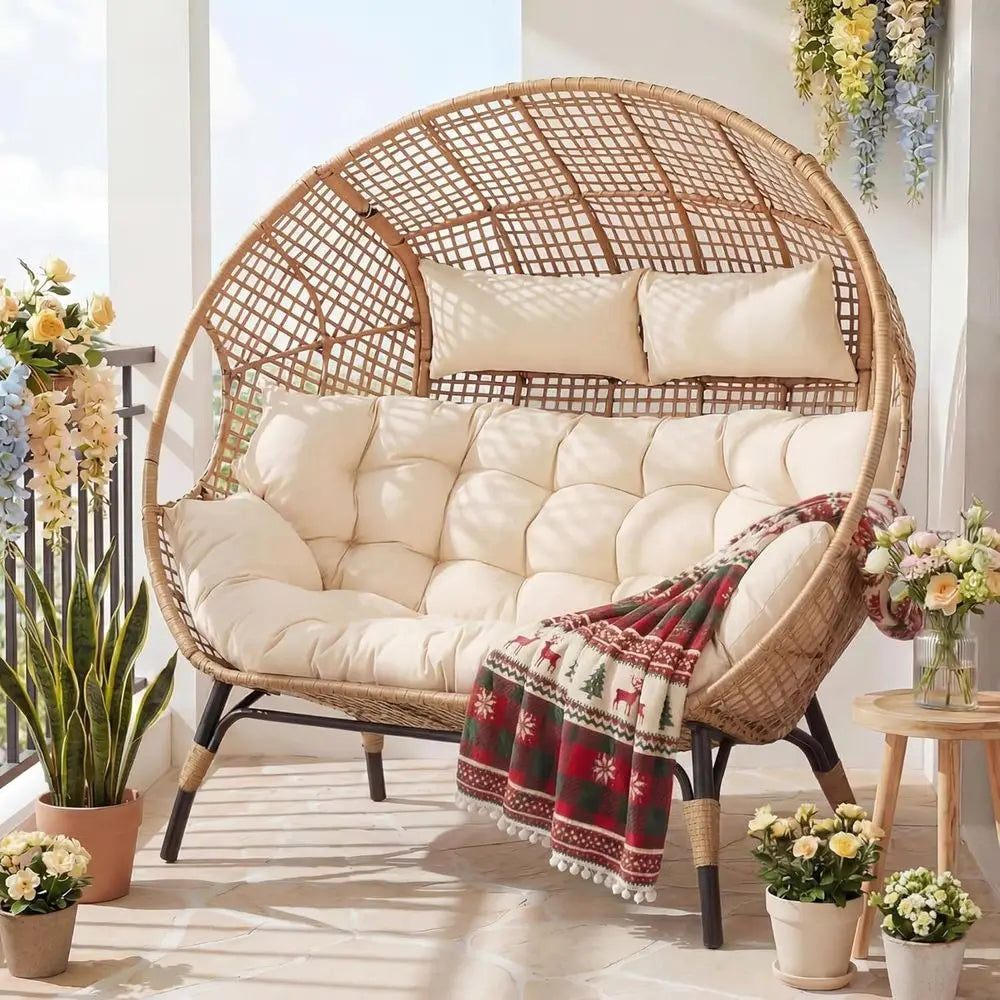 Oversized 2-person egg wicker chair with beige cushions, stationary outdoor patio loveseat