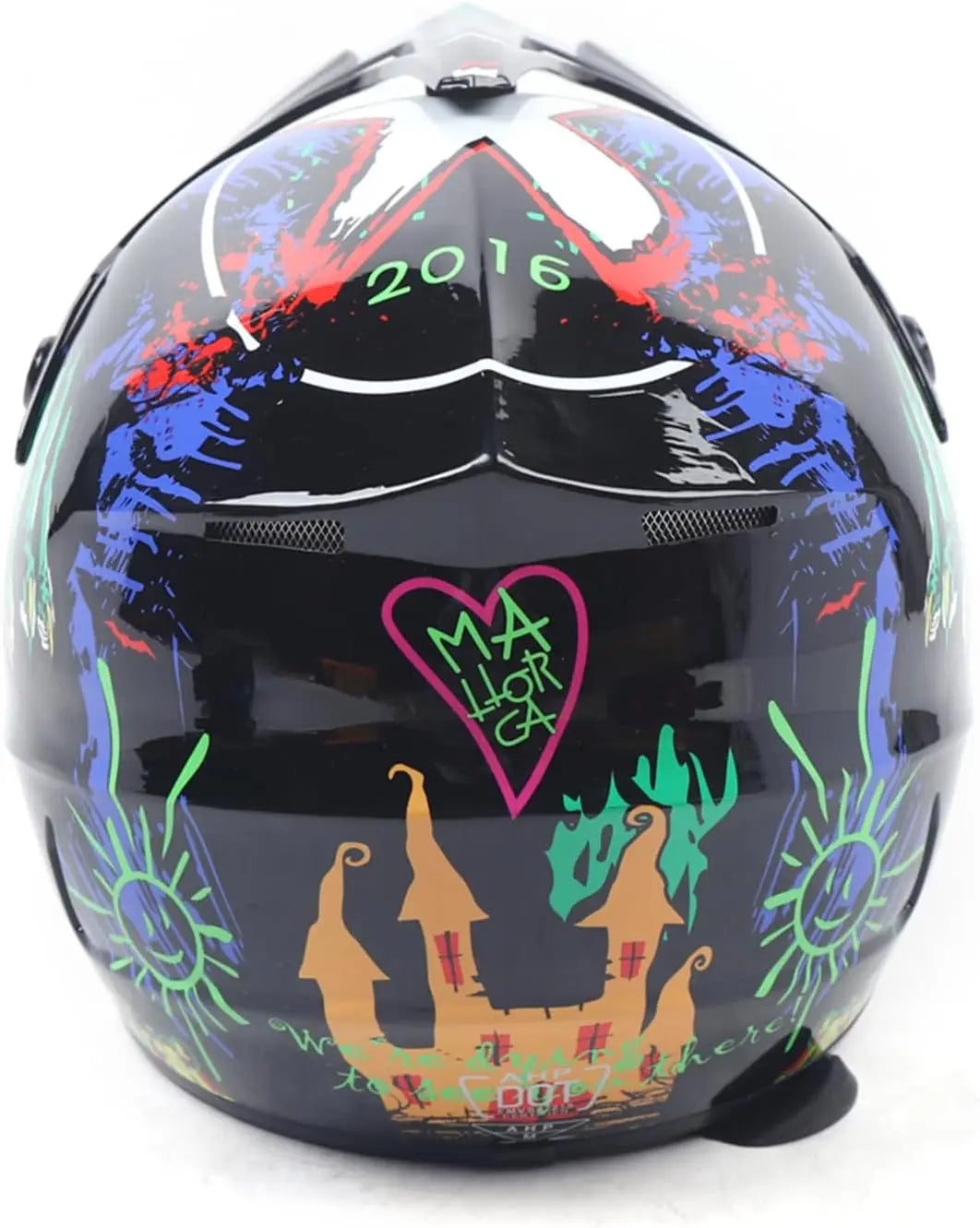 Motorcycle full-face helmet with black shell and neon splash graphic; 2016, pink heart emblem, castle shapes.