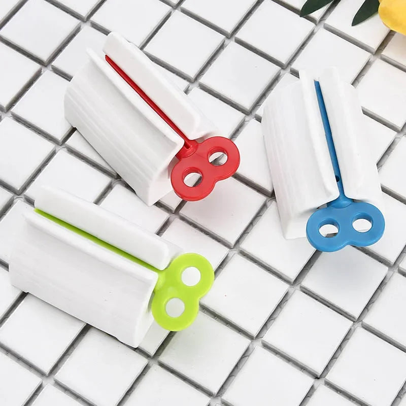 Toothpaste tube squeezers, 3-pack with white bodies and red, blue and lime handles for smooth, hassle-free brushing