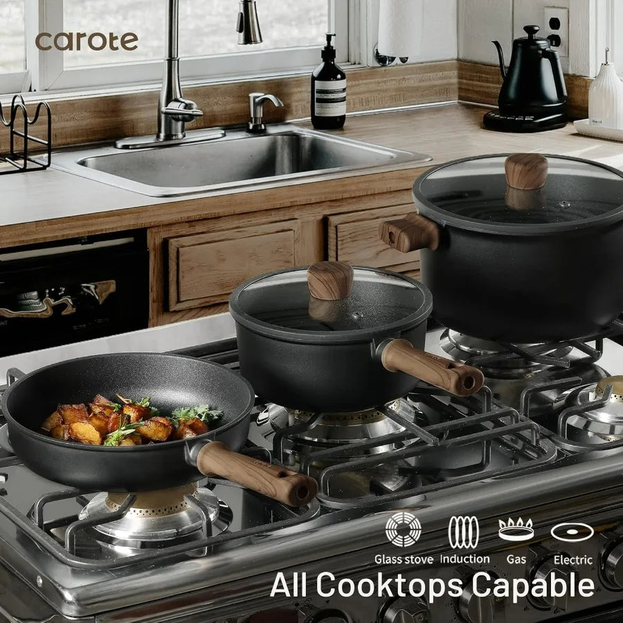 Nonstick cookware set by Carote, black with wooden handles and glass lids on a gas stove