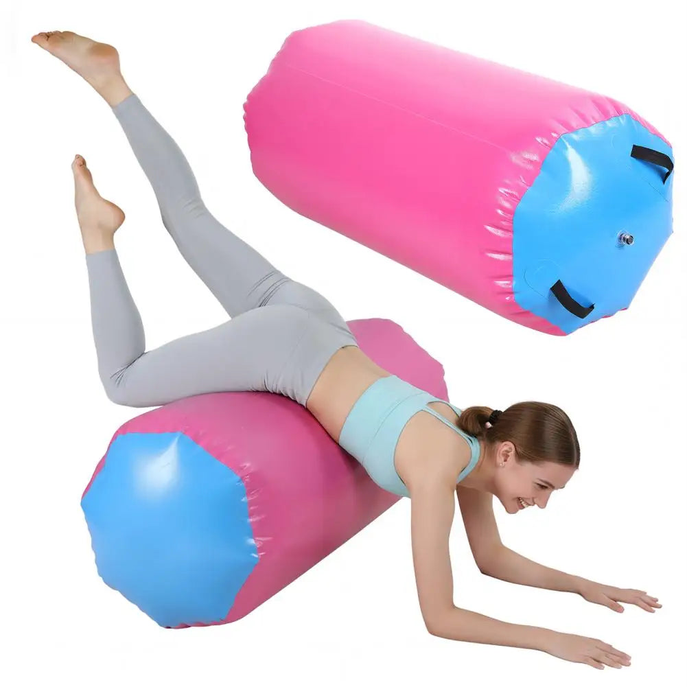 Air roller gymnastics barrel inflatable tumbling roller in pink and blue with a person using it.