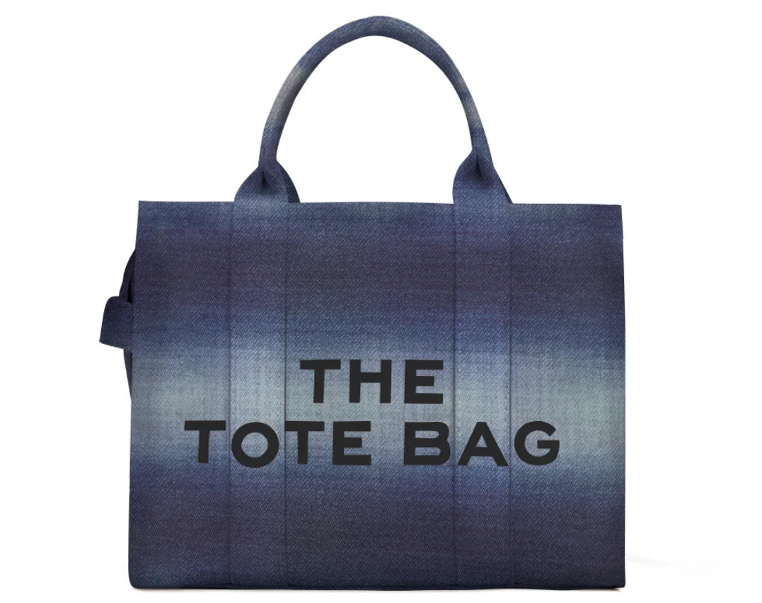 Denim gradient canvas tote bag with large capacity and two handles, front says THE TOTE BAG