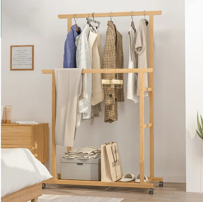 Bamboo free-standing clothes rack with double hanging rails on wheels and storage shelf by S And B Enterprise