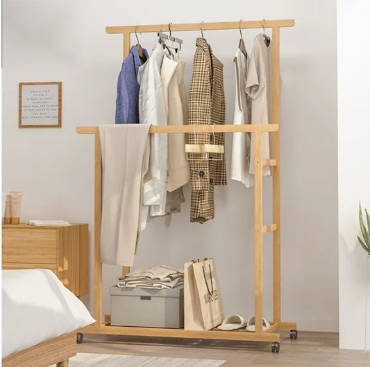 Natural bamboo clothes rack with double hanging rails, storage shelf, and caster wheels