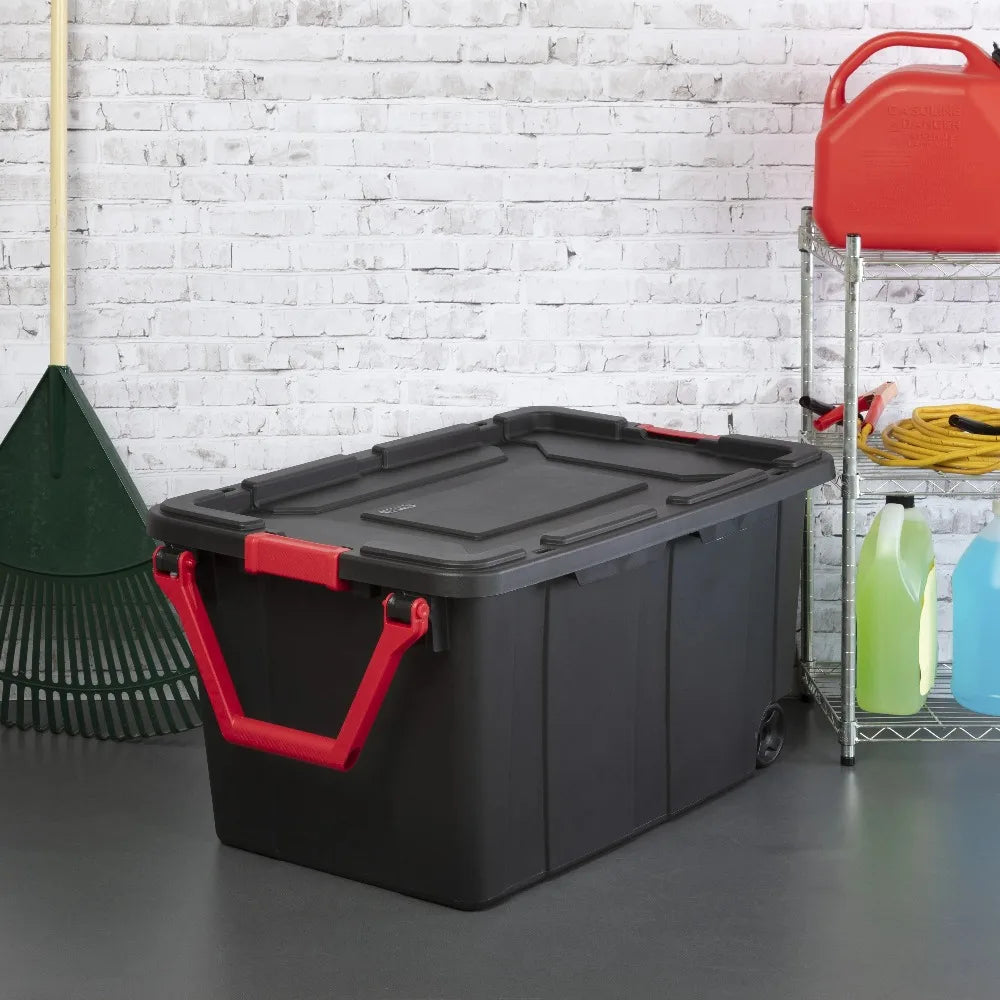 Sterilite 40-gallon wheeled storage bin with red handles, black plastic