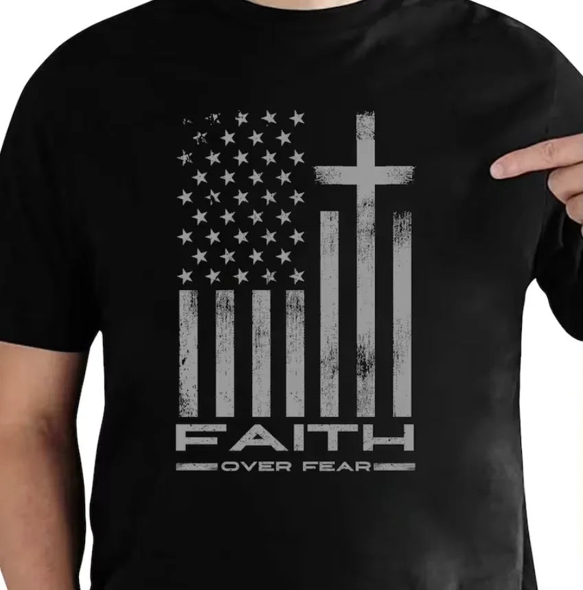 Men's black T-shirt with a distressed gray flag graphic and faith over fear text.