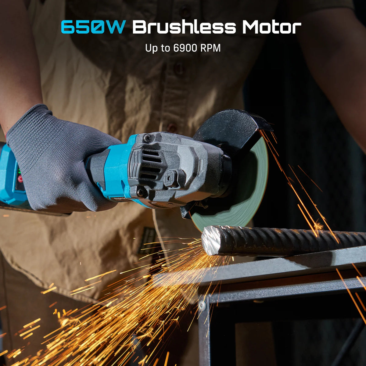 Blue cordless angle grinder in use, with metal sparks flying as gloved hand guides the grinding disc.