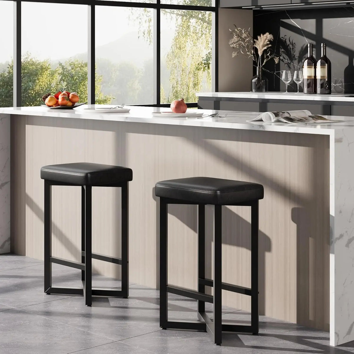 Two black PU leather backless bar stools with metal X-frame and footrests at a kitchen island.