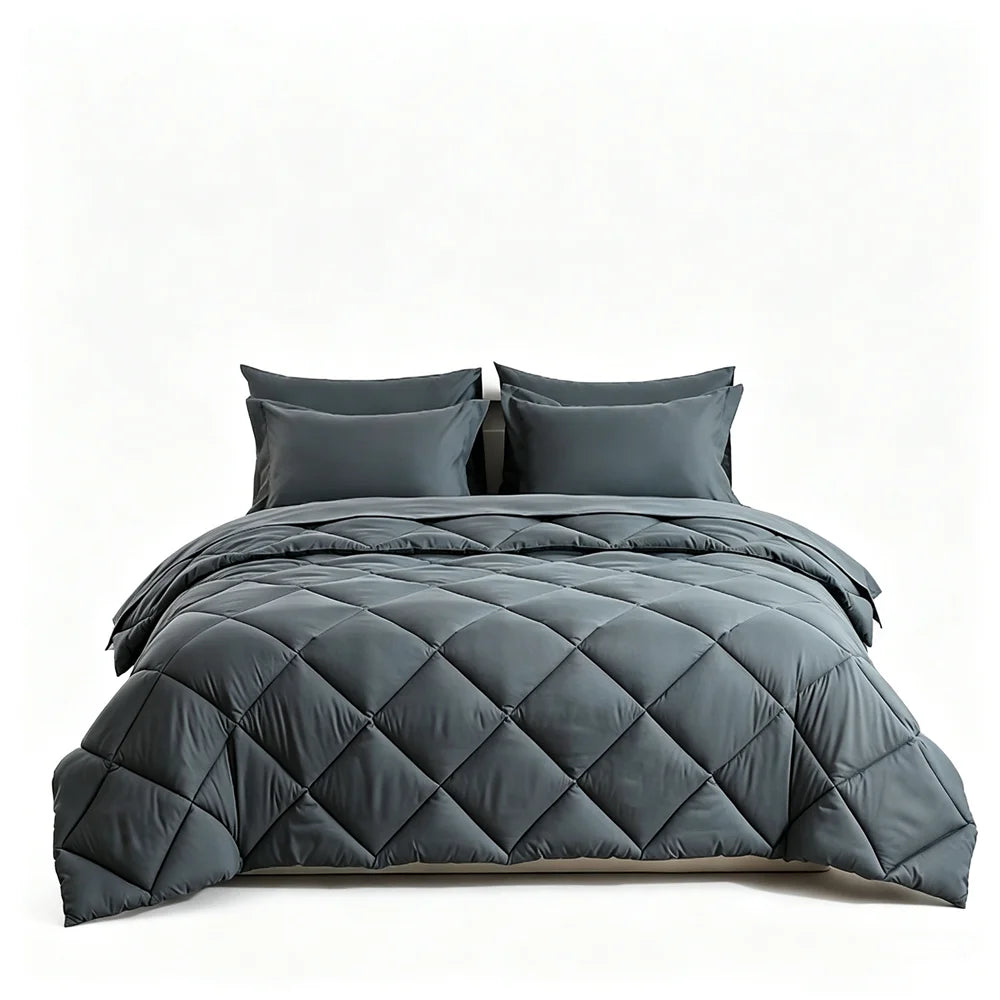 Quilted dark gray comforter bedding set with matching pillow shams on a bed (4 pillows)