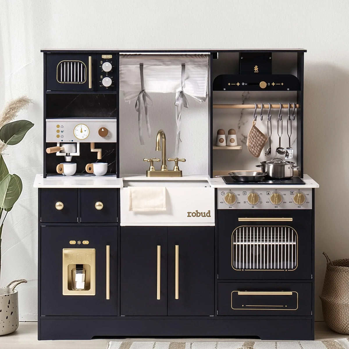 Robotime Robud wooden play kitchen in black and white with brass fixtures, sink, stove, oven and hanging cookware