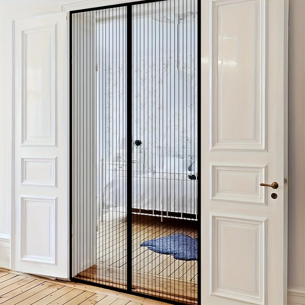 Heavy-Duty retractable screen door by S And B Enterprise with seamless black mesh in a doorway.