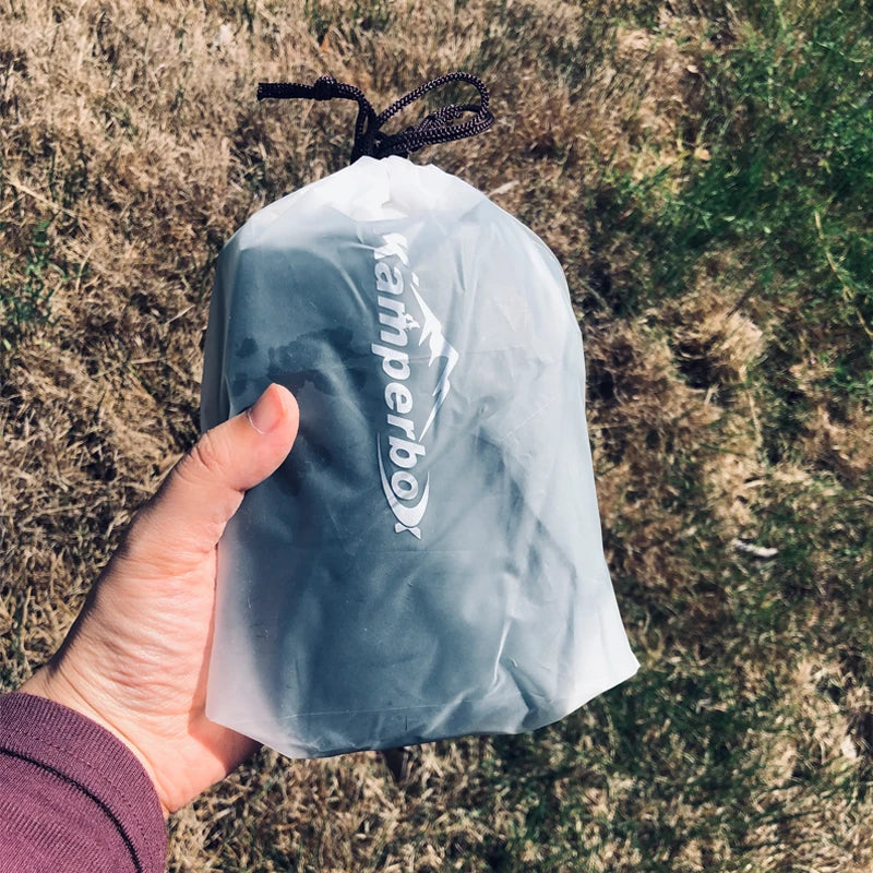 Kamperbox sleeping bag down booties in a gray drawstring pouch