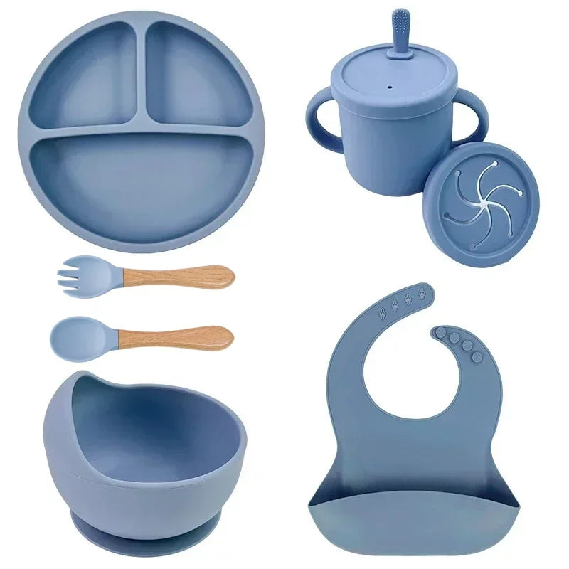 Food grade silicone six-piece set: divided plate, suction bowl, cup with straw, wooden-handled spoon and fork, bib.
