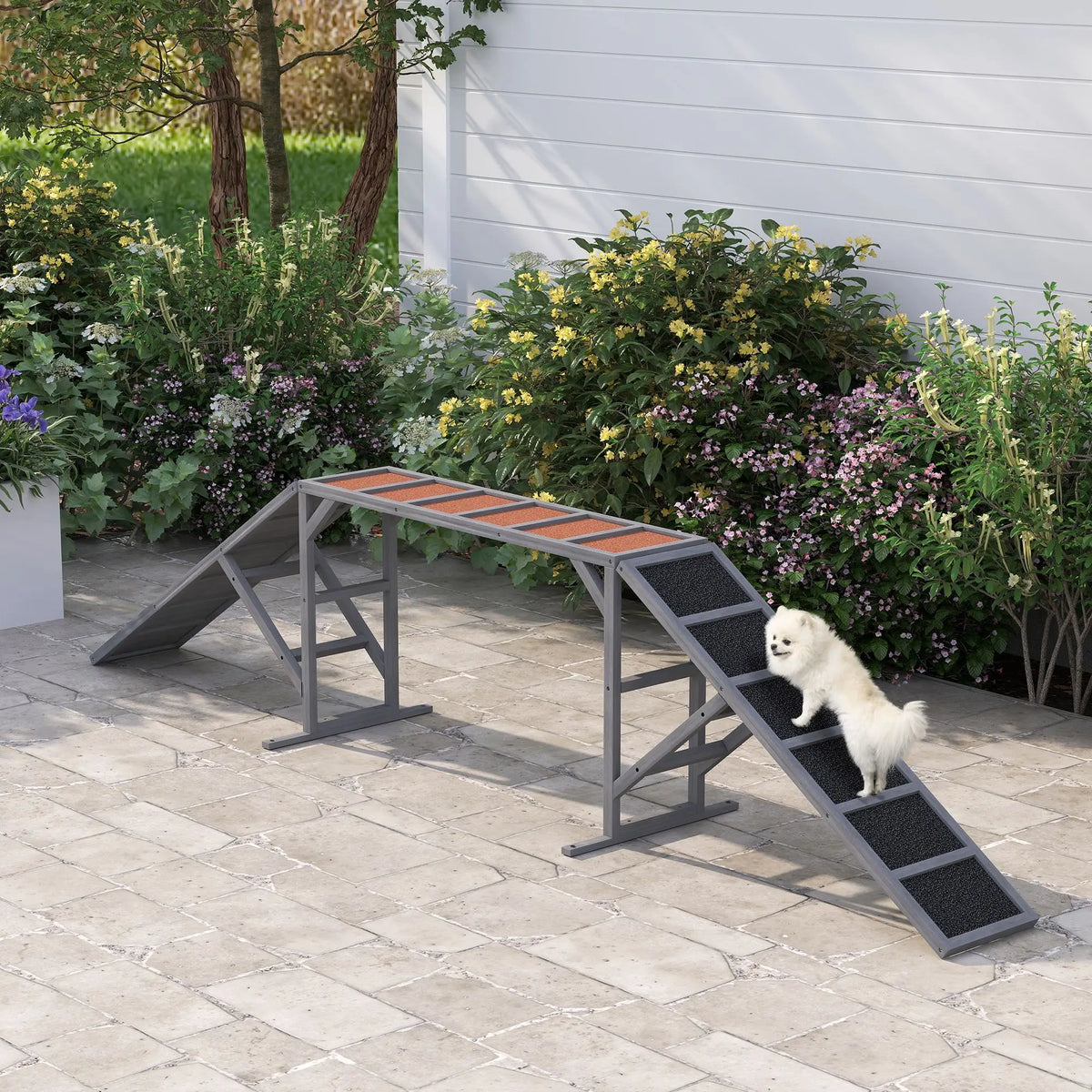Two gray dog agility ramps with safety bars and non-slip surfaces for walk and pause training