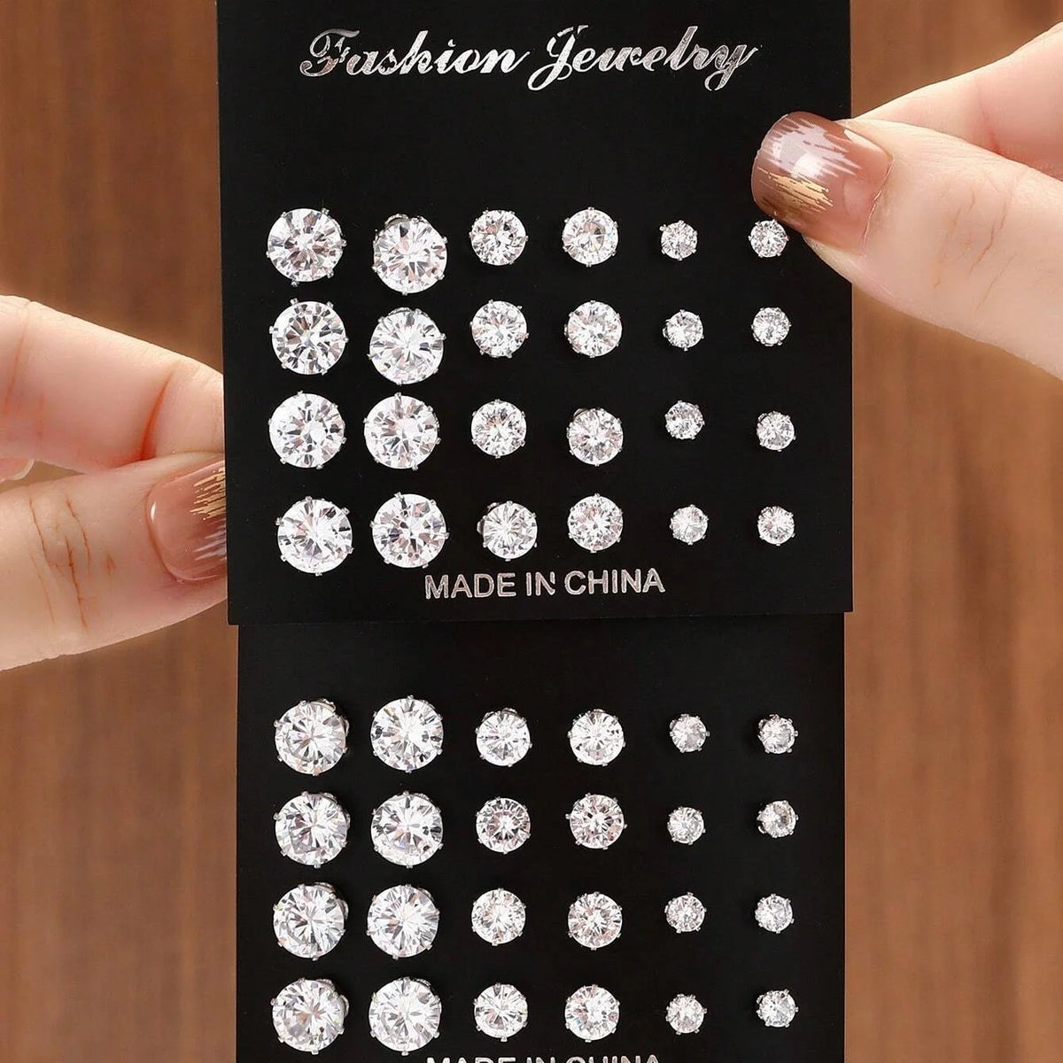 Zirconia stud earrings set, 12 pairs on black display cards with clear stones