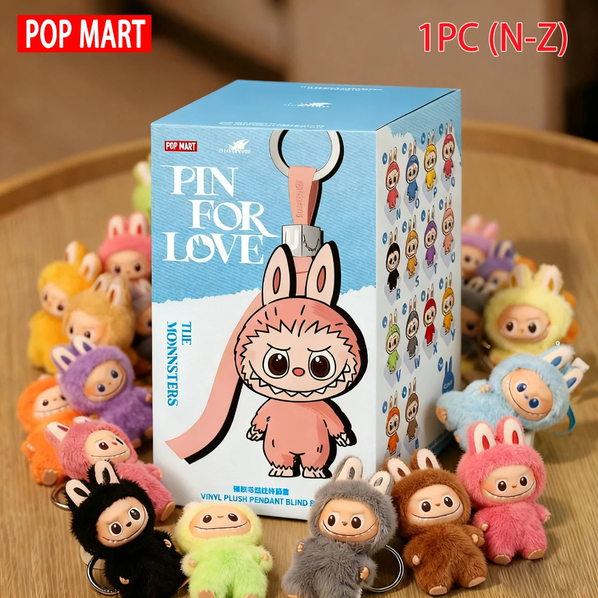 POP MART Labubu plush dolls box set with a pink bunny character, surrounded by colorful mini plush keychains