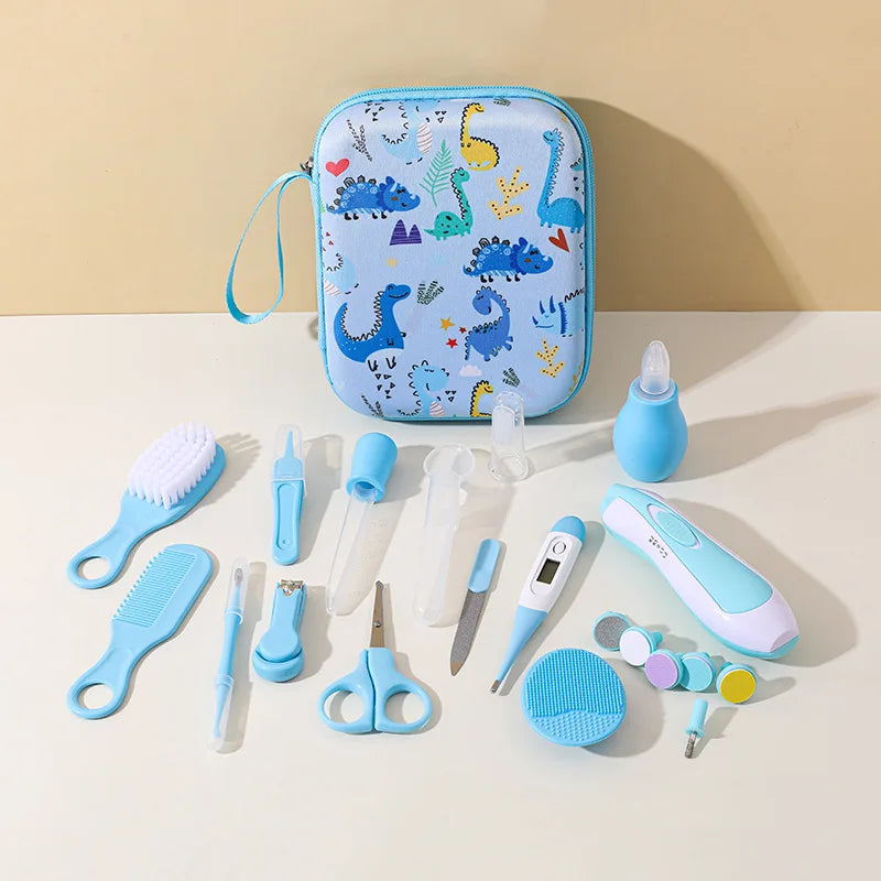 20pc baby kit by S And B Enterprise in blue dinosaur-print case with brush, comb, nasal aspirator and nail scissors.