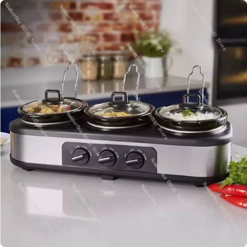Silver triple slow cooker with three 1.5-quart pots on a stainless-steel base.