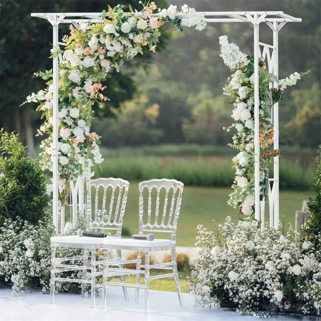Stereoscopic white metal garden arch arbor with floral garlands for outdoor weddings; two white chairs shown.