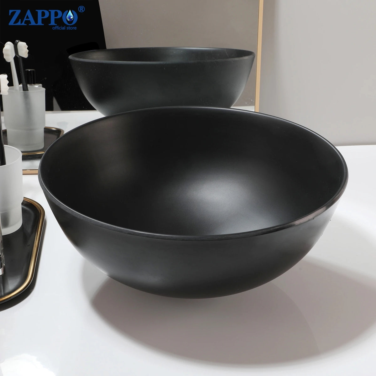 Bathroom vessel sinks by ZAPPO; two black matte round bowls for above-counter use.