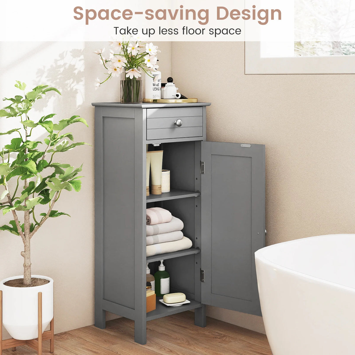 Gray freestanding bathroom storage cabinet with a drawer and open shelves.