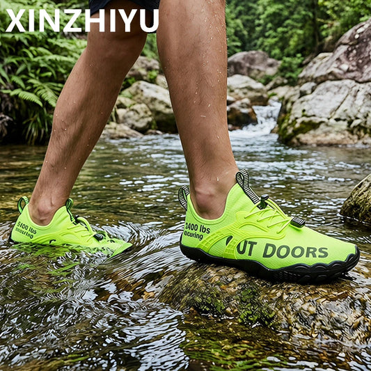 Men's neon green water shoes by XINZHIYU; quick-dry aqua sneakers, a pair shown on a rocky stream.
