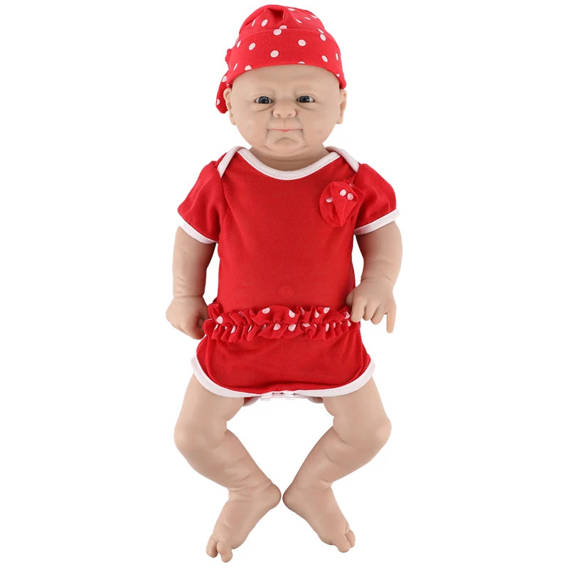 Silicone reborn baby doll; lifelike newborn girl in red outfit with white trim and polka-dot hat