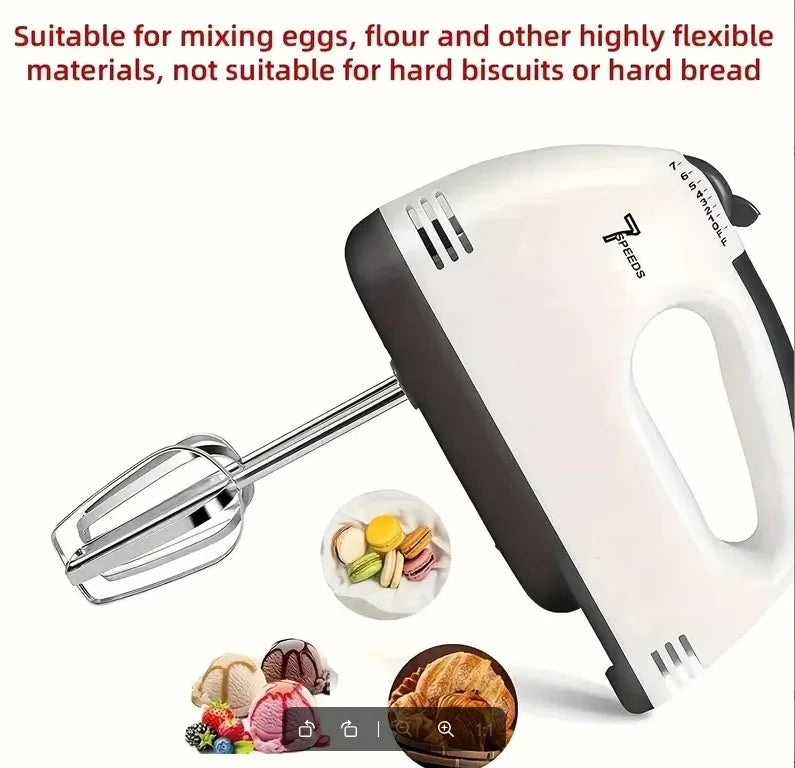 White handheld electric mixer with stainless steel beaters for home baking