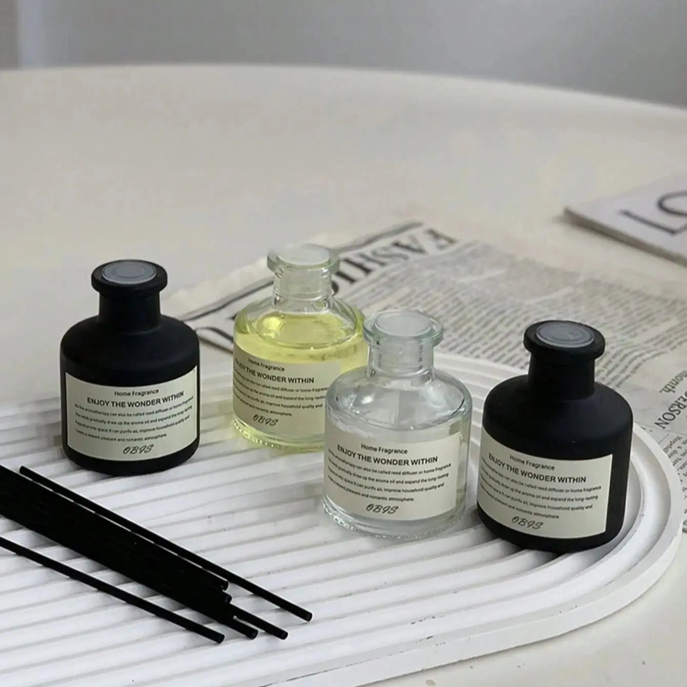 50ml flameless fragrance oil set with 4 bottles (black and clear glass) and reed diffuser sticks